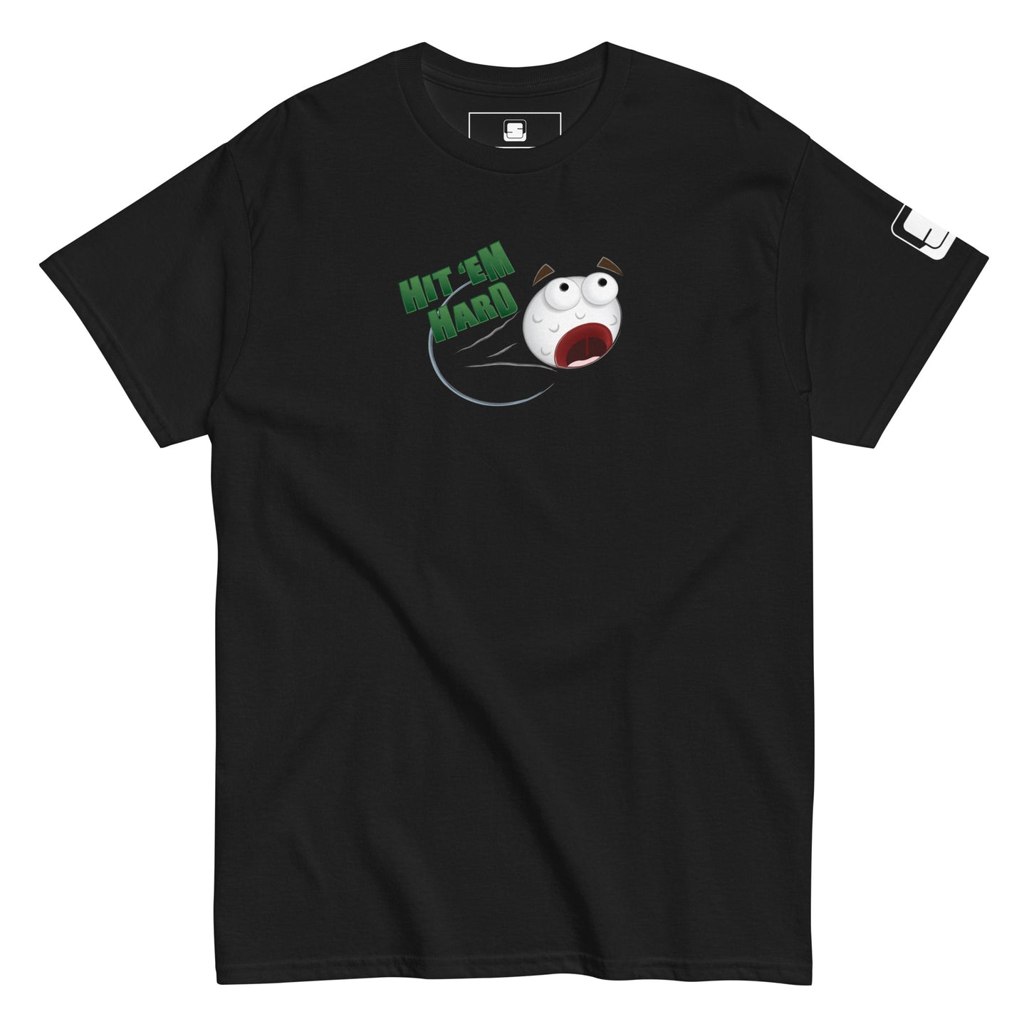  A black t-shirt is laid flat, featuring a colorful graphic in the center. The graphic depicts a distressed cartoon golf ball with wide eyes and an open mouth, flying through the air. Above the golf ball, the phrase "HIT 'EM HARD" is printed in bold, green letters. The golf ball leaves a streak behind it, emphasizing its high speed. The right sleeve has a small white logo patch. The bold graphic stands out against the black background, creating a fun and energetic design.