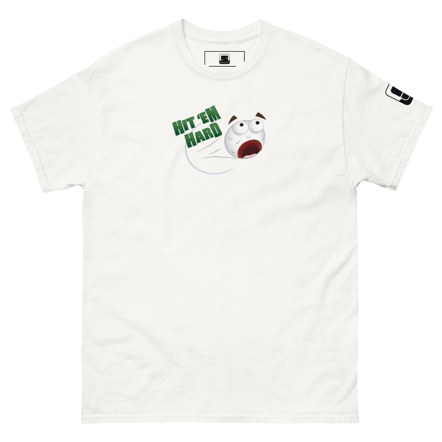  A white t-shirt is laid flat, featuring a colorful graphic in the center. The graphic depicts a distressed cartoon golf ball with wide eyes and an open mouth, flying through the air. Above the golf ball, the phrase "HIT 'EM HARD" is printed in bold, green letters. The golf ball leaves a streak behind it, emphasizing its high speed. The right sleeve has a small white logo patch. The bold graphic stands out against the black background, creating a fun and energetic design.
