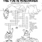 Activity page titled 'Fall Fun in Monsterville,' featuring a crossword puzzle with themed clues such as 'Spooky holiday' and 'Orange gourd.' The page includes three playful cartoon monsters: one with horns on the left, another waving enthusiastically in the center, and a third sitting on a stone platform to the right. The background depicts a fun, rocky outdoor scene.