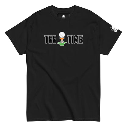  The image showcases a black t-shirt with the phrase "TEE TIME" in white letters, featuring a graphic of a golf ball on a tee with a small green plant below. A white square logo is on the right sleeve. The t-shirt is displayed flat, with its soft fabric texture slightly visible. The t-shirt's design contrasts sharply with the plain background, focusing attention on the playful golf-themed graphic.