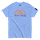 Carolina Blue t-shirt showcasing the 'CAMP MORE' phrase in purple with an orange mountain range illustration, complete with a black logo patch on the sleeve, isolated on a white background.