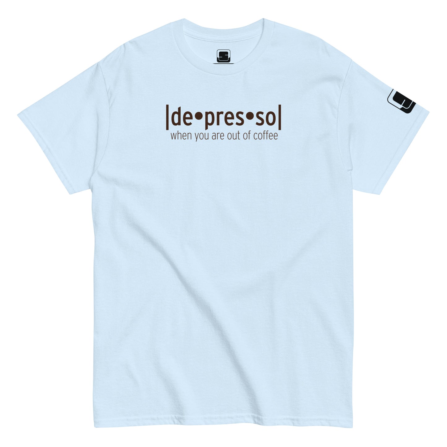 Light blue t-shirt with the humorous phrase '[de]presso' followed by 'when you are out of coffee' in dark lettering, featuring a small black logo patch on the sleeve, displayed on a flat surface with a white background.