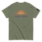 Military green t-shirt laid flat showcasing the 'CAMP MORE' slogan in purple with an orange mountain range illustration, complete with a black logo patch on the sleeve, isolated on a white background.