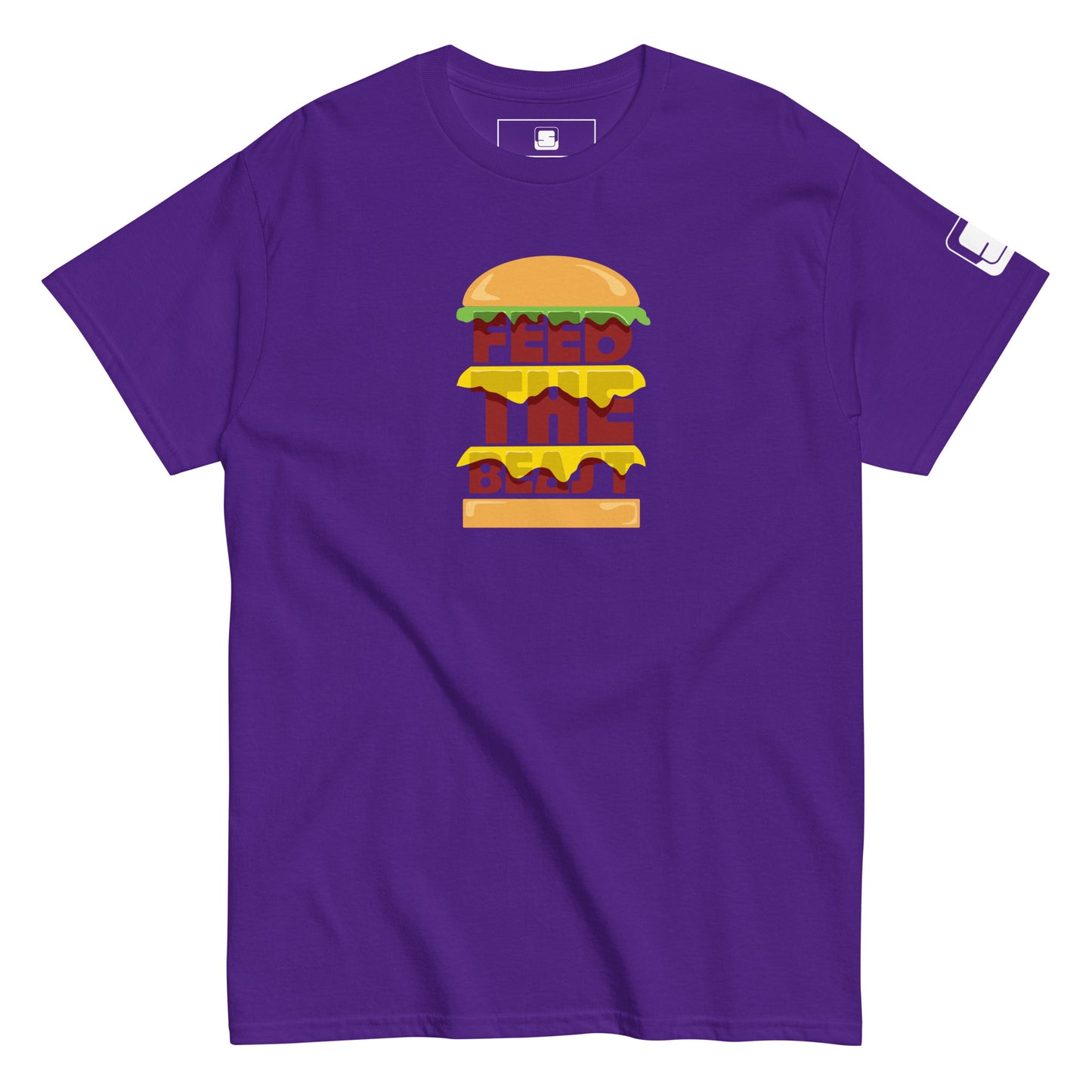 Purple t-shirt with 'FEED THE BEAST' in bold, stacked yellow and red lettering embedded in a detailed burger graphic, featuring a small logo patch on the sleeve, presented on a plain white background.