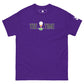 The image presents a bold purple t-shirt with the text "TEE TIME" and an image of a golf ball on a tee with a small green sprout at the base. The graphic is centered on the chest area. A small white logo appears on the right sleeve. The t-shirt is spread out flat to display its design clearly against a plain background, highlighting the vibrant color and the playful, golf-inspired motif