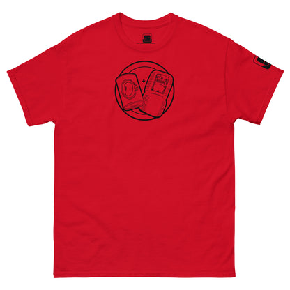 A vibrant red t-shirt is laid flat with a black line graphic printed in the center. The design features a circular emblem containing a can of beans and sine bologna, playfully arranged with a "+" sign between them. The right sleeve has a small black logo patch. The t-shirt is designed to be casual and stylish, with a clean background emphasizing the bold color and humorous graphic, creating a standout piece.