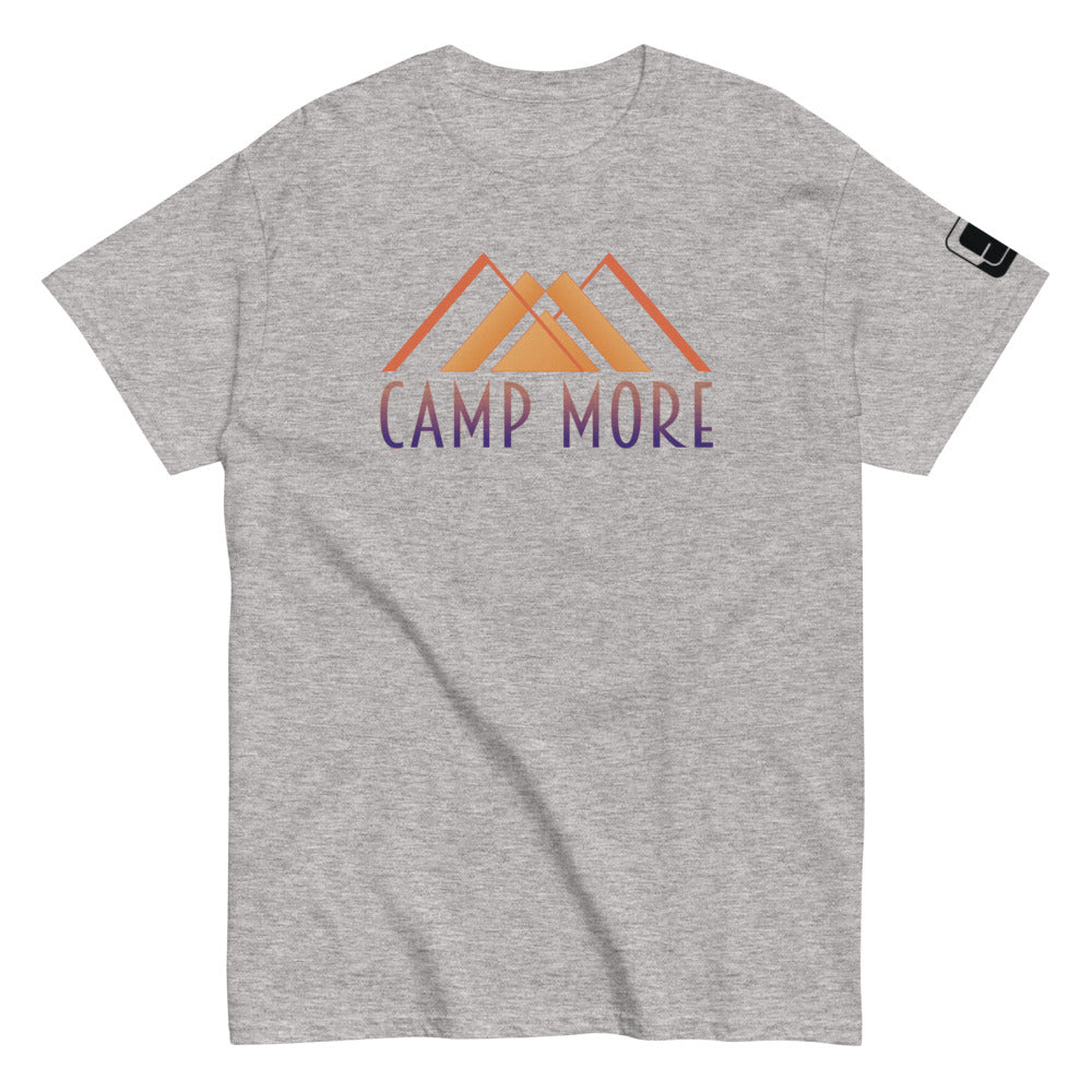 Sport Grey t-shirt laid flat showcasing the 'CAMP MORE' slogan in purple with an orange mountain range illustration, complete with a black logo patch on the sleeve, isolated on a white background.