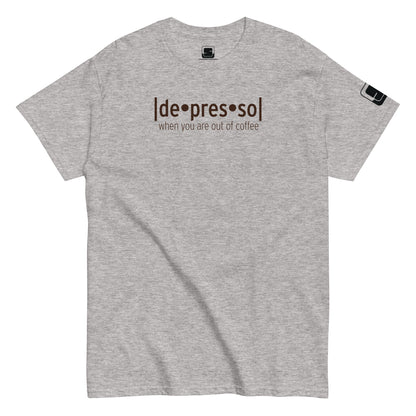 Heather grey t-shirt with the humorous phrase '[de]presso' followed by 'when you are out of coffee' in dark lettering, featuring a small black logo patch on the sleeve, displayed on a flat surface with a white background.