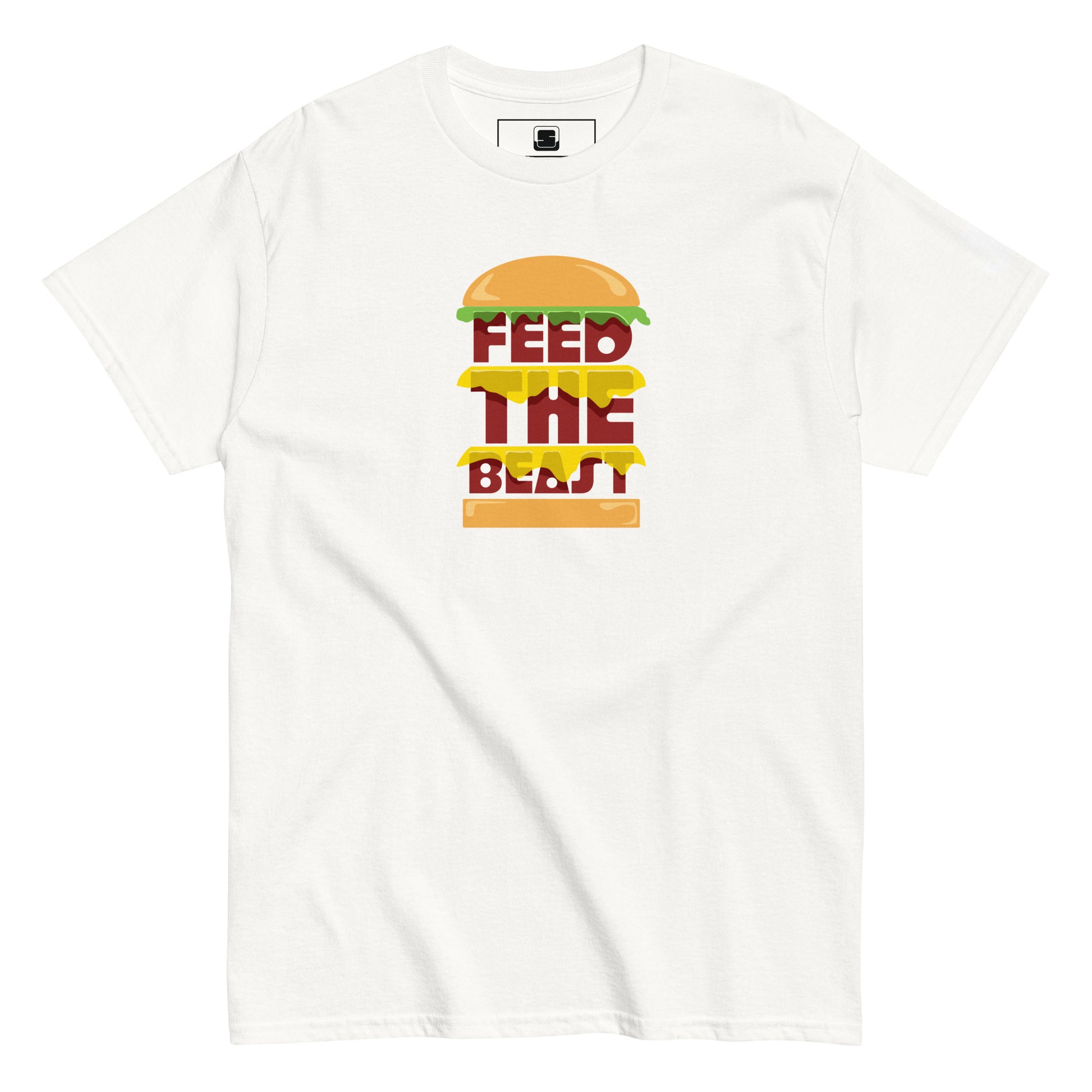 White t-shirt with 'FEED THE BEAST' in bold, stacked yellow and red lettering embedded in a detailed burger graphic, featuring a small logo patch on the sleeve, presented on a plain white background.