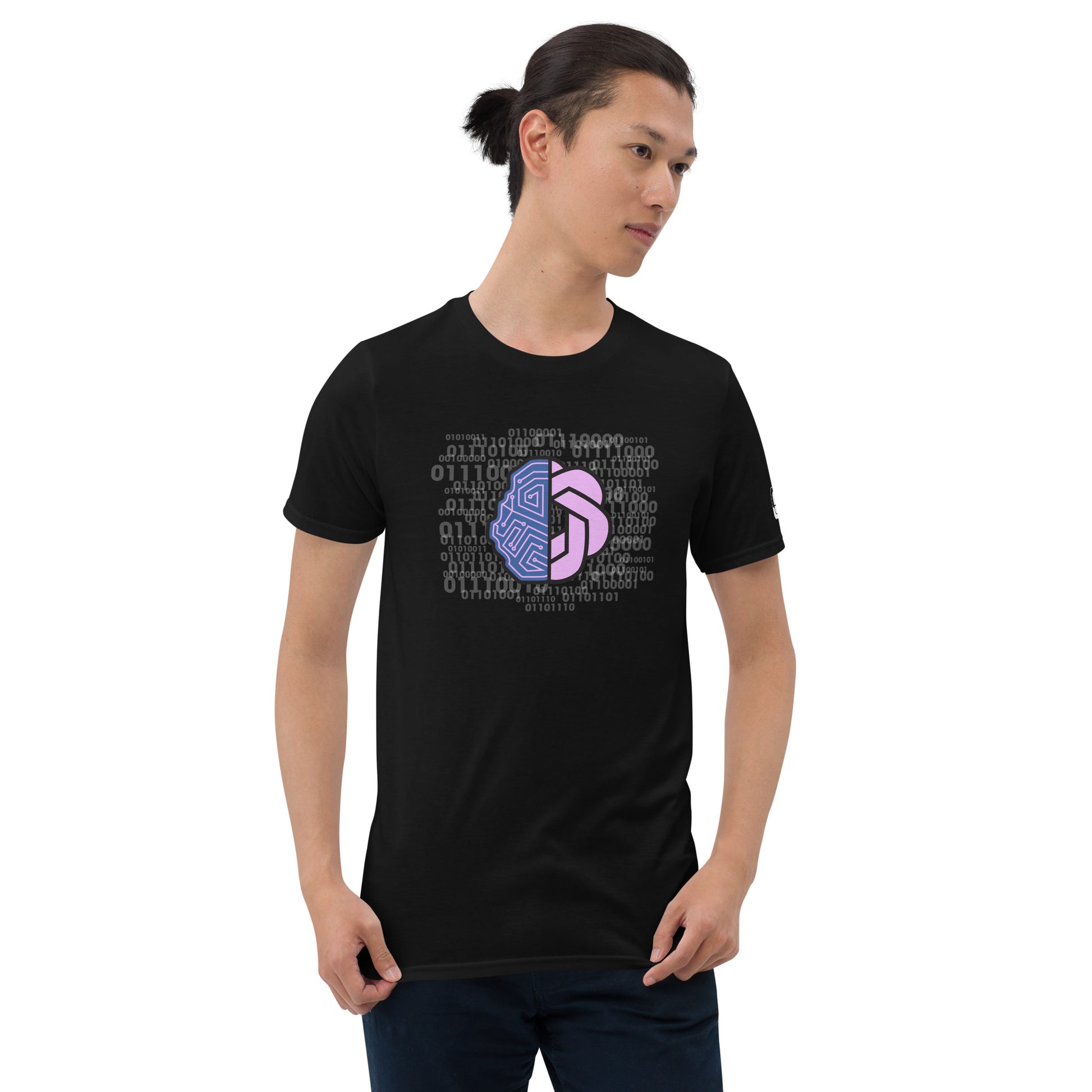 Serene young man with a ponytail wearing a black t-shirt with a central pink and purple geometric design surrounded by a matrix of binary code, complete with a logo tag on the sleeve, against a simple white background.