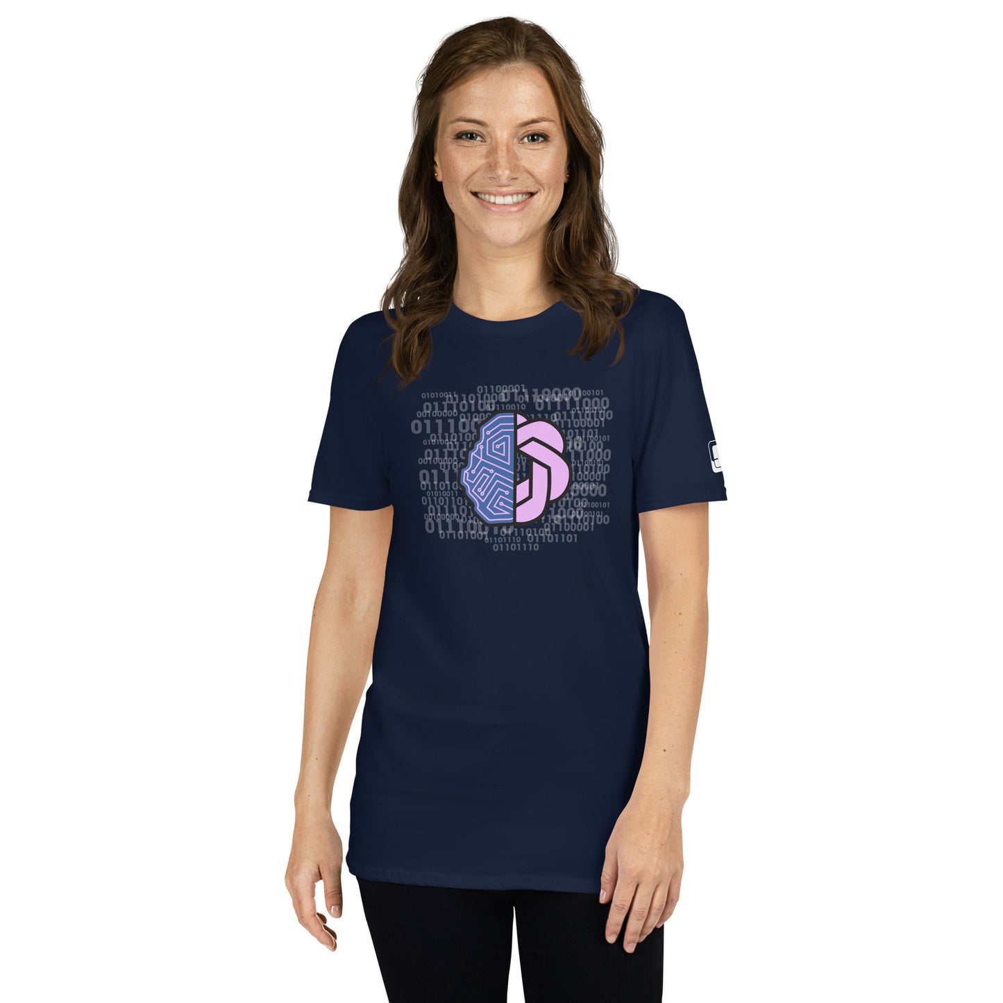 Smiling woman wearing a navy blue t-shirt with a bright pink and purple abstract geometric design surrounded by binary code, a small logo patch on the sleeve, standing against a light white background.