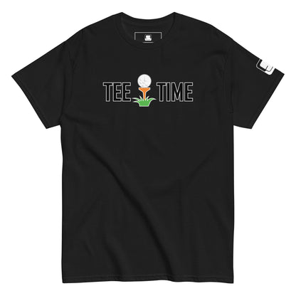  The image showcases a black t-shirt with the phrase "TEE TIME" in white letters, featuring a graphic of a golf ball on a tee with a small green plant below. A white square logo is on the right sleeve. The t-shirt is displayed flat, with its soft fabric texture slightly visible. The t-shirt's design contrasts sharply with the plain background, focusing attention on the playful golf-themed graphic.