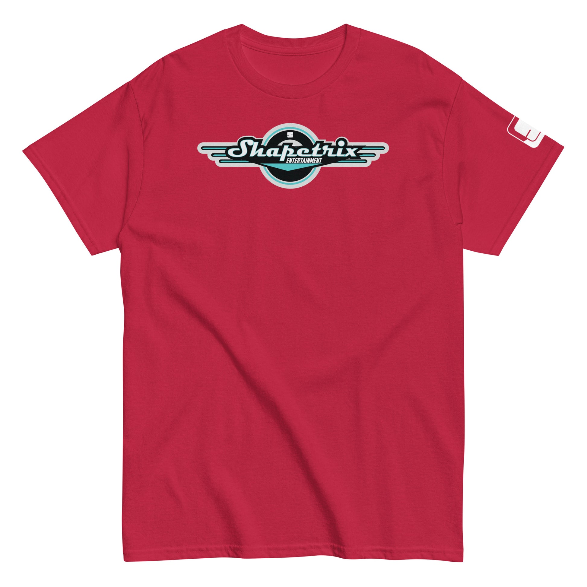 A flat-laid deep red t-shirt featuring the Shapetrix Entertainment logo prominently on the chest. The logo, set against a black circle, features stylish, elongated white and teal lettering with a winged design on each side, symbolizing a blend of classic and modern aesthetics. The left sleeve is adorned with a small, rectangular Shapetrix Entertainment tag, adding a discrete branding detail to the overall design of the shirt.