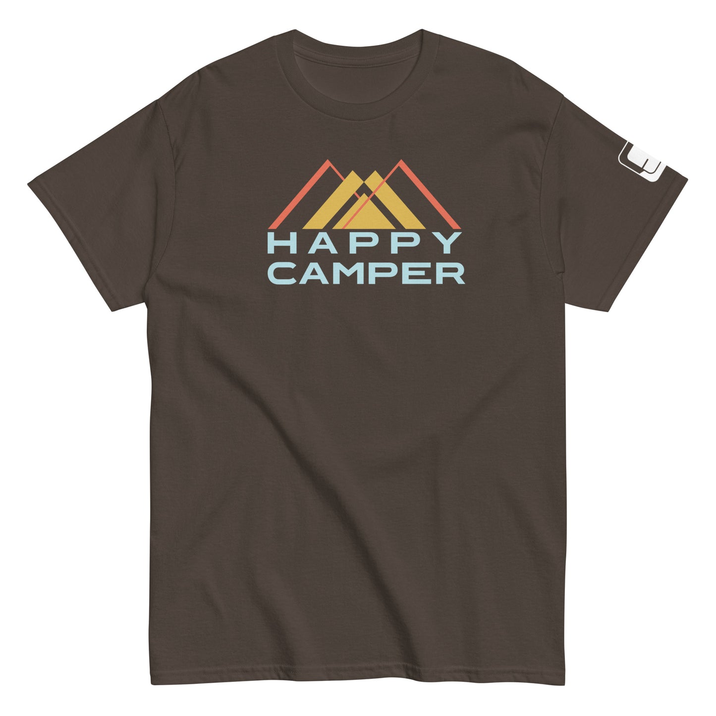 A brown t-shirt featuring an artistic representation of three mountain peaks in red, yellow, and orange colors, overlaid with a stylized blue and light blue "HAPPY CAMPER" text, set against the mountain backdrop. The shirt has a casual fit with a crew neck and short sleeves, suitable for outdoor enthusiasts.