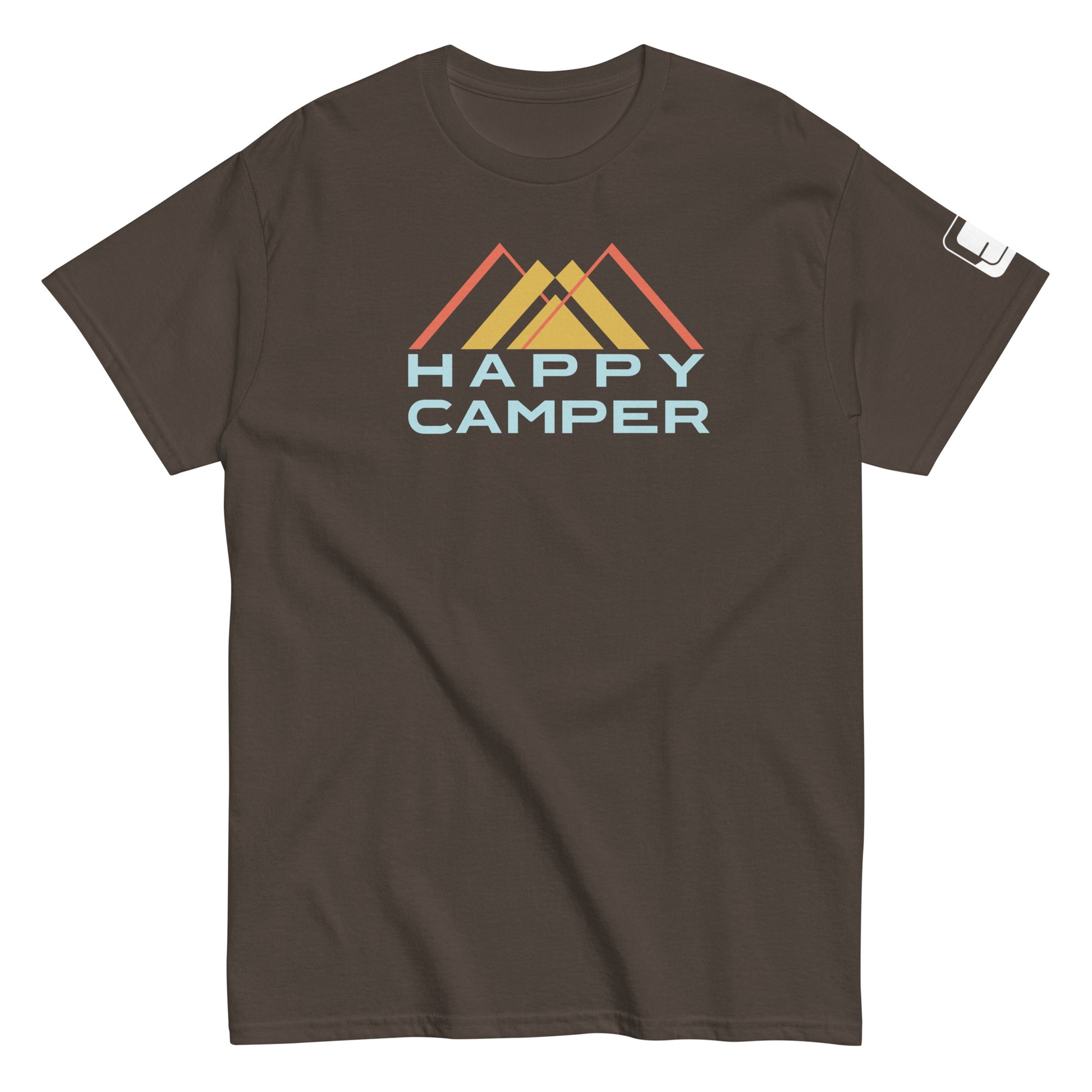 A brown t-shirt featuring an artistic representation of three mountain peaks in red, yellow, and orange colors, overlaid with a stylized blue and light blue "HAPPY CAMPER" text, set against the mountain backdrop. The shirt has a casual fit with a crew neck and short sleeves, suitable for outdoor enthusiasts.