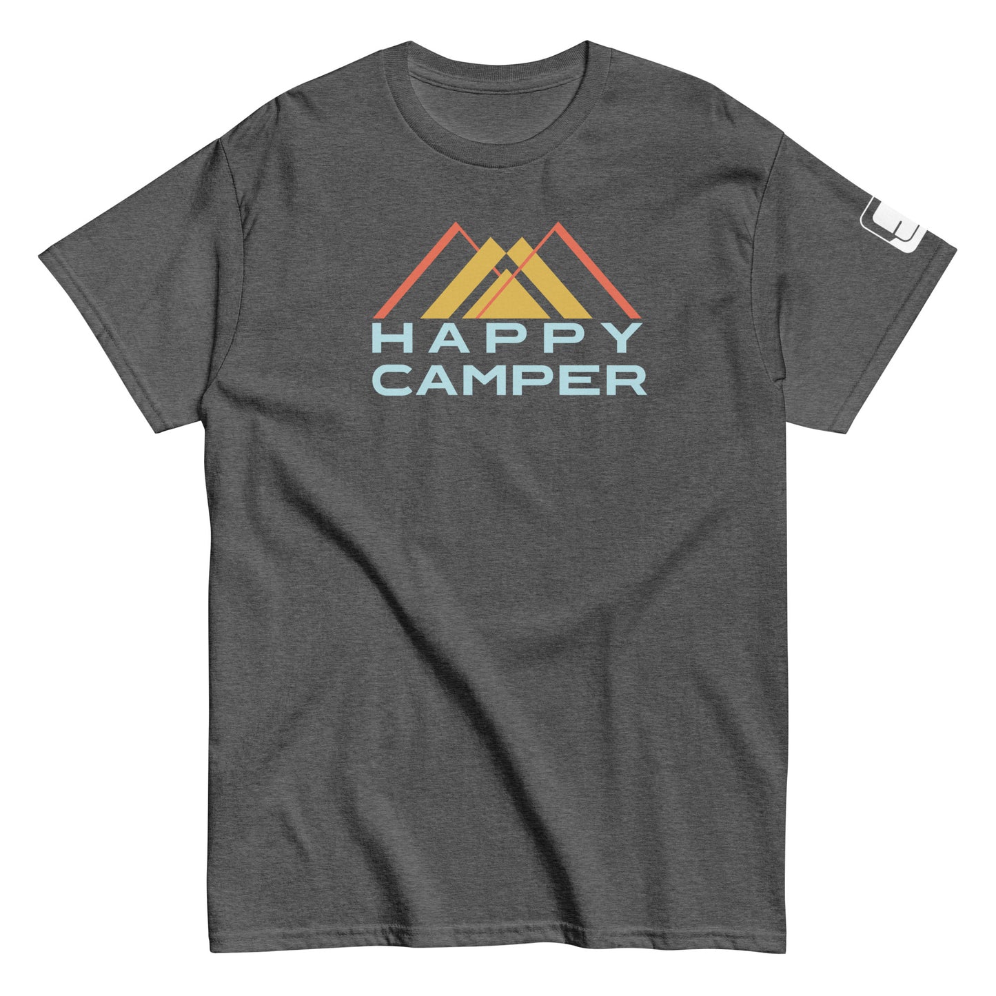 A charcoal gray t-shirt displaying the "Happy Camper" graphic. The design includes a stylized mountain scene with three peaks colored in shades of yellow and orange. The phrase "HAPPY CAMPER" is displayed beneath the mountains in a light blue, bold sans-serif font. This casual, crew-neck t-shirt is made for a comfortable fit, suitable for both outdoor activities and everyday wear.