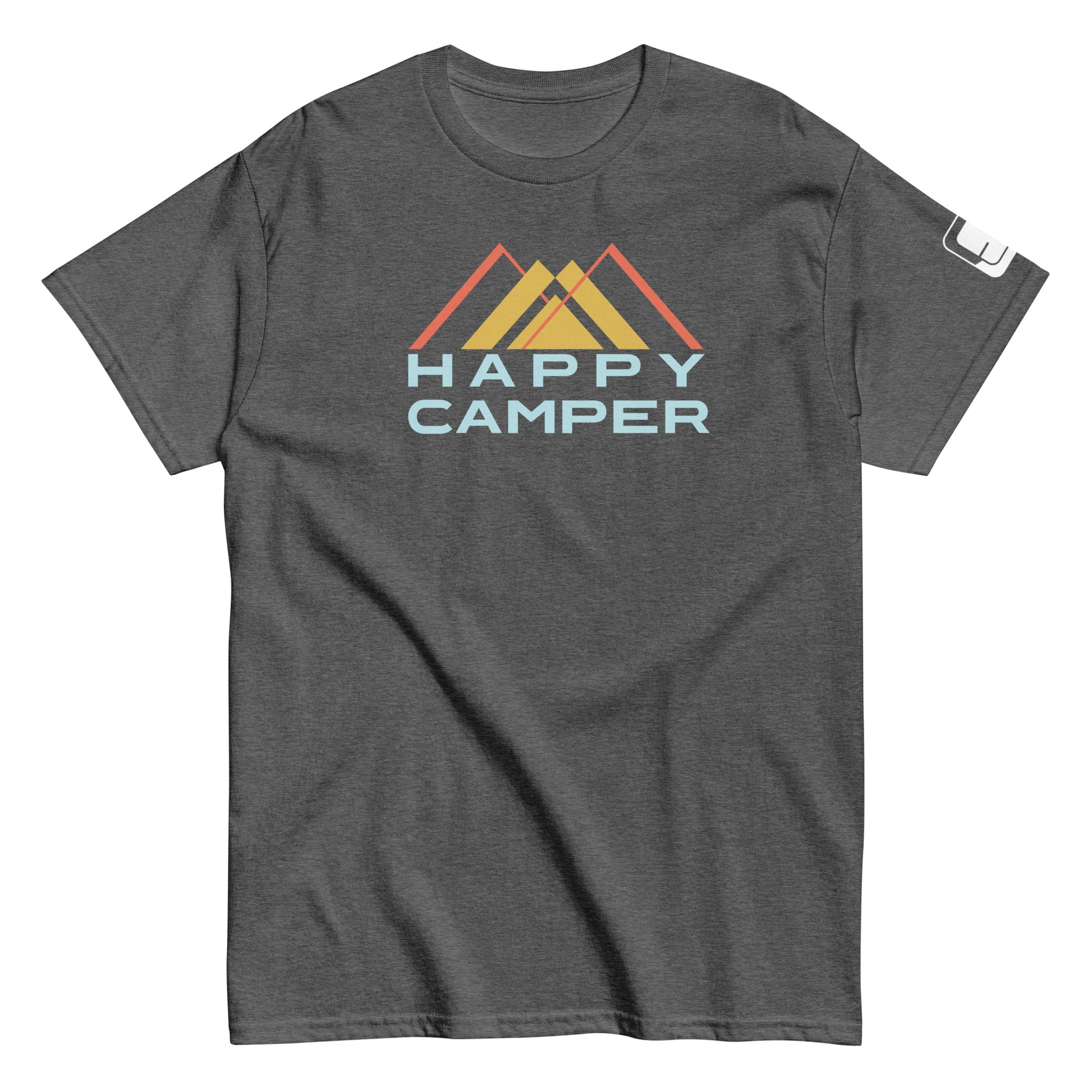 A charcoal gray t-shirt displaying the "Happy Camper" graphic. The design includes a stylized mountain scene with three peaks colored in shades of yellow and orange. The phrase "HAPPY CAMPER" is displayed beneath the mountains in a light blue, bold sans-serif font. This casual, crew-neck t-shirt is made for a comfortable fit, suitable for both outdoor activities and everyday wear.