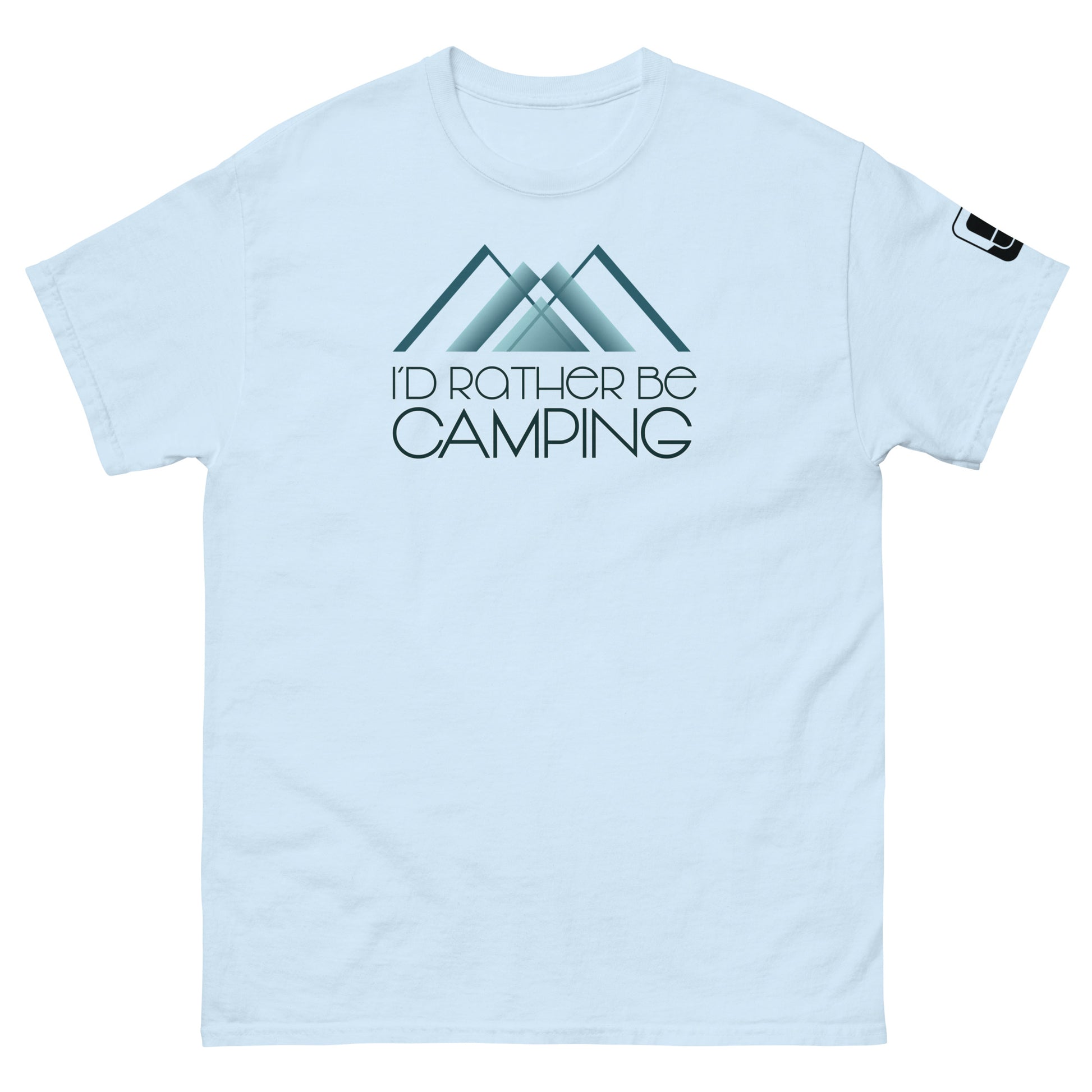 
A light blue t-shirt featuring a design with two stylized teal mountains and the phrase "I'D RATHER BE CAMPING" in black, elegant font just beneath the peaks. The graphic is positioned centrally on the chest area. The t-shirt includes a small logo patch on the right sleeve, complementing its casual outdoor aesthetic.