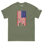A military green T-shirt displays a vertically aligned American flag, with a blue square full of stars in the upper left and stripes of red and white extending downwards. At the base of the flag, there's a silhouette of the iconic Iwo Jima flag-raising scene, depicting soldiers working together to hoist the flag. This graphic blends historical reverence with a modern style on the T-shirt.