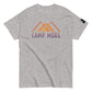 Sport Grey t-shirt laid flat showcasing the 'CAMP MORE' slogan in purple with an orange mountain range illustration, complete with a black logo patch on the sleeve, isolated on a white background.