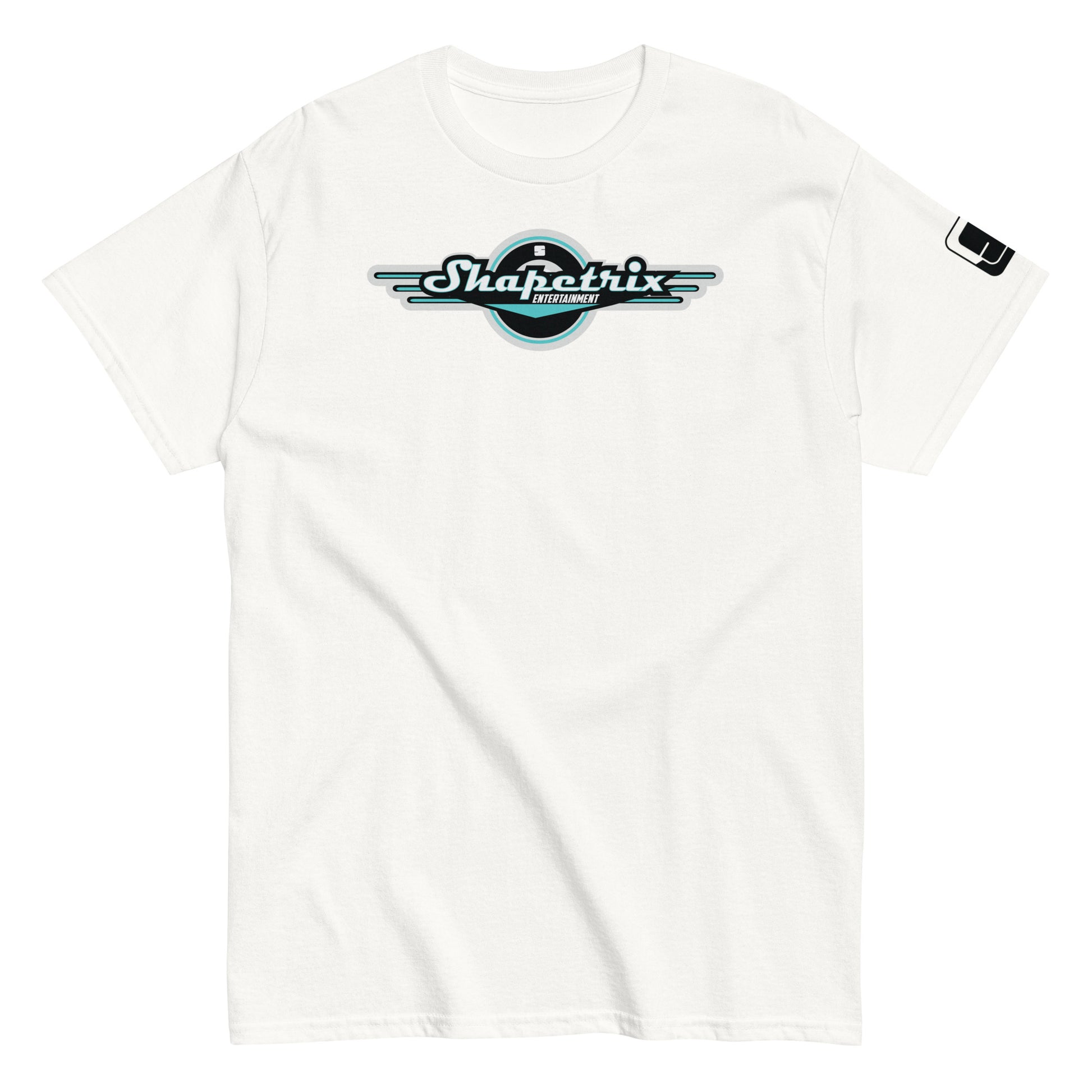 A plain white t-shirt laid flat, featuring the Shapetrix Entertainment logo centrally placed. The logo includes the brand name in stylish teal and white lettering inside a black circle, accented by elongated white wing-like graphics on both sides. A tag on the left sleeve shows a tiny black and white Shapetrix Entertainment label, enhancing the clean and modern appeal of the shirt.