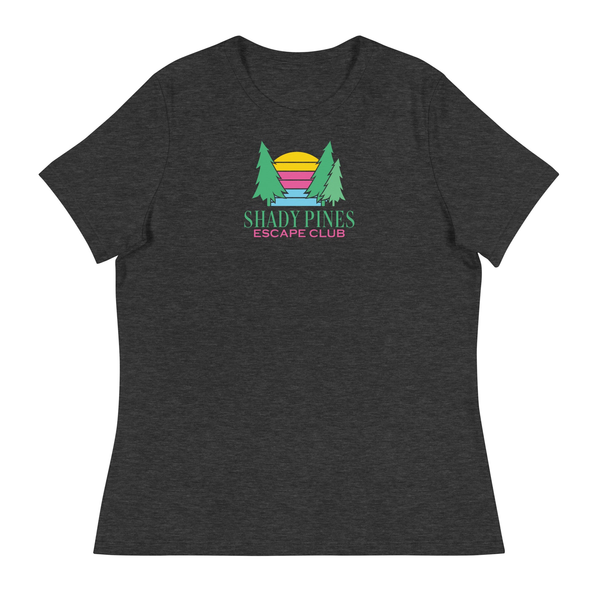 A dark gray t-shirt featuring the "Shady Pines Escape Club" logo centered on the front. The logo includes two green pine trees framing a stylized sunset with horizontal stripes in yellow, pink, purple, and blue. Below the graphic, "SHADY PINES" is written in bold green text, with "ESCAPE CLUB" in smaller pink letters underneath. The design is vibrant and modern, standing out against the dark fabric, making it perfect for casual outdoor wear.
